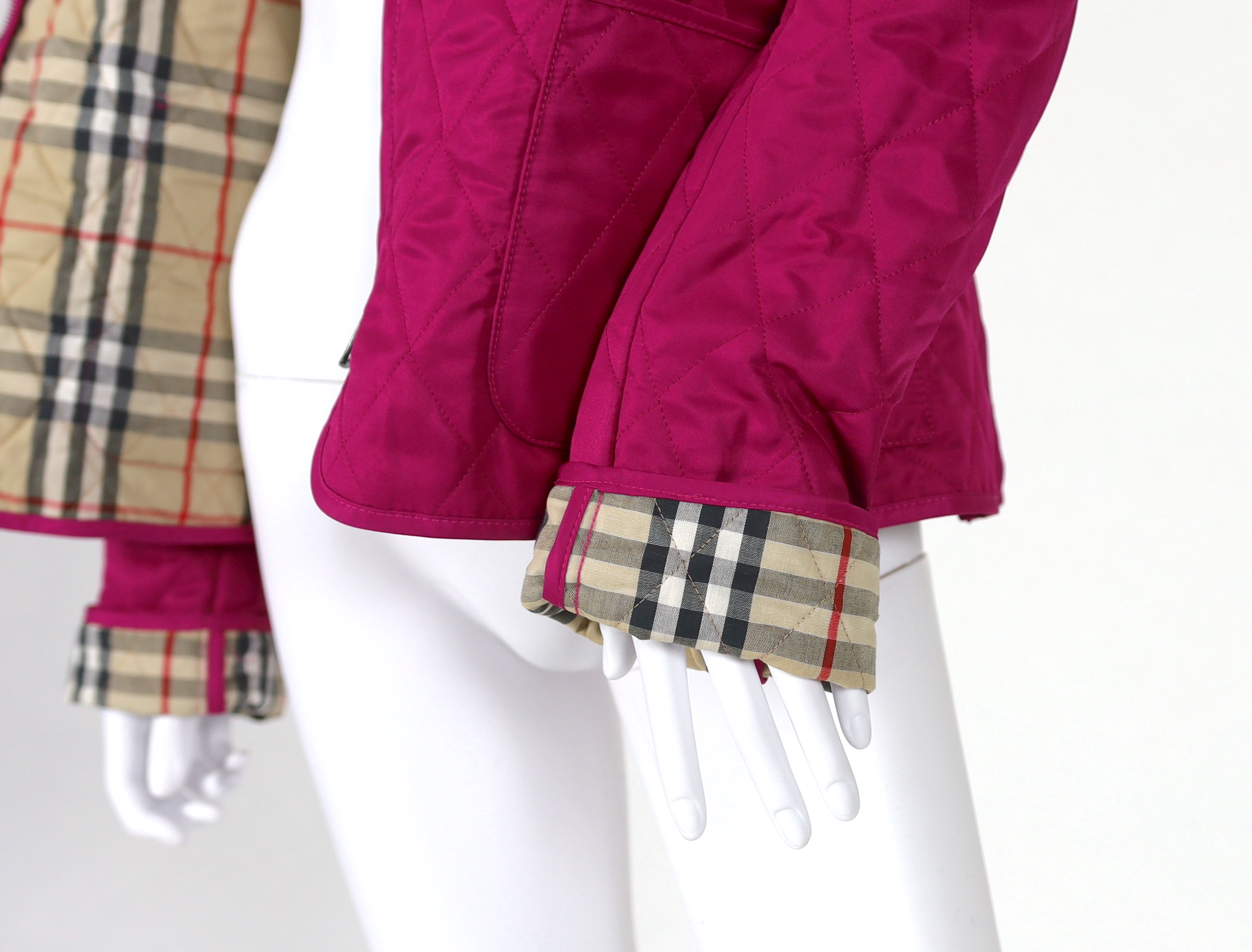 Two Burberry lady's quilted jackets, one pink and the other green, size Medium